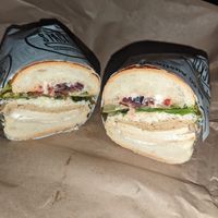Vegan muffaletta on white roll at Stacked Sandwich Shop in Queens