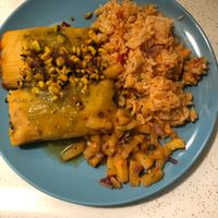 Portobello & asparagus tamale on top and spinach & artichoke tamale on the bottom with corn salsa, green salsa, and pineapple salsa.  at Casa de Tamales in Fresno