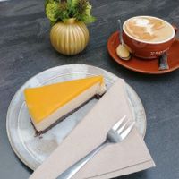 Mango-cheezecake and cappuccino with soy milk at Cafebar Utopia in Bad Windsheim