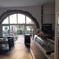 Courtyard seating at Caffè dell'Arte Boutique Rooms in Locarno