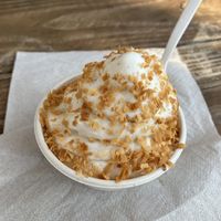 Piña colada combo (pineapple vegan ice cream with coconut flakes) at Zeds Real Fruit Ice Cream in Austin