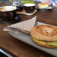 Vegan cheese bagel and decaf oat milk latte. at Remé in Dusseldorf