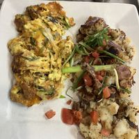 Seasonal vegan scramble. Three-“eggs” with cheese. Great potatoes    at Naked Cafe in Carlsbad
