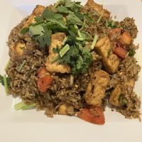 Number 63e - Indian Curry Fried Rice with tofu (rice fried with tomato, green onion and cilantro seasoned with mild yellow curry powder). at King and I Thai in Mendota Heights
