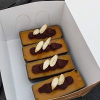 Vegan pastry with chewy almond base, sweet topping, chocolate ganache and almond halves. at Bageri Brantingstorg in Uppsala