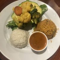Vegetable stuffed avocado with rice and beans at Café El Punto in San Juan