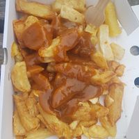Chips and curry sauce at Papa's Fish & Chips in Scarborough