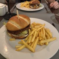 Vegan burger served with fries  at N° 7 in Krakow