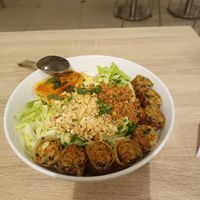 Bowl with tofu and spring rolls at Loving Hut - Nowolipie in Warsaw