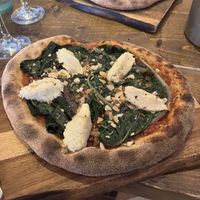 Wilted greens, almond ricotta and dukkah pizza   at Hoogah Cafe in Swansea