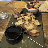 Warm breads, oil and olives  at Hoogah Cafe in Swansea