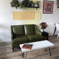 Money green leather sofa  at Session in Virginia Beach