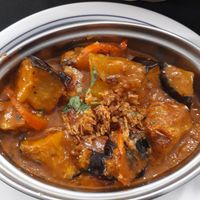 Aubergines with herbs and spices + bread with almonds and sultanas at Taj Indian Restaurant in Girona