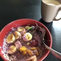 Vegan power bowl, sprig of mint, banana, strawberry, peaches, berry smoothie   at 13th Ave Coffee House in Regina