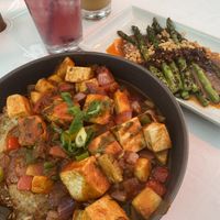 Tofu dish with adobo, pineapple, peppers, onions and a crispy rice cake  at Stones Throw in York