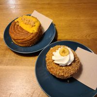 Mango Macadamia Pastry (top left) and Banana Pudding Salted Pretzel Donut (bottom right) at Delish Vegan Doughnuts - Malasaña in Madrid