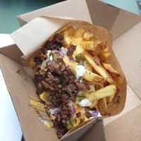 Fries with pickled cucumber, red onion and minced beyond meat at Eden Jaxx - Købmagergade in Copenhagen