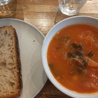 Delicious tomatoe soup with chickpeas and cale, (ordered without butter on bread to make it vegan) at Birch in Isle Of Skye