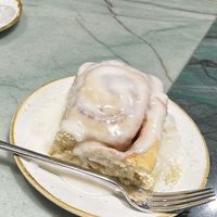 Cinnamon roll with way too much glaze  at Chimneys Friedrichshain in Berlin