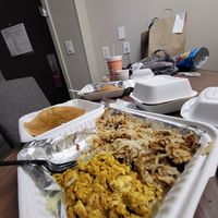 Stack of pancakes hashbrowns and tofu scramble at Seven Mile Cafe in Lewisville