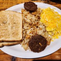 The Unusual (Beyond Meat sausage, Just Egg scramble with vegan cheese, hashbrowns, sourdough toast) at Seven Mile Cafe in Lewisville