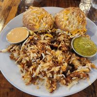 Berkeley Biscuit Sandwich (biscuit sandwich with Beyond vegan sausage, vegan cheese, and Just Egg), and a side of hashbrowns at Seven Mile Cafe in Lewisville