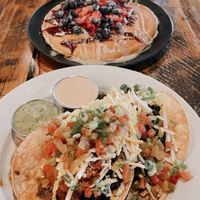 Vegan Huevos (front), Vegan Berry Dream Pancake (middle), and Vegan loaded potatoes (far back).   at Seven Mile Cafe in Lewisville
