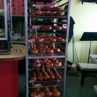 Bringing in the day's glazed. at Pepples Donut Farm in Berkeley