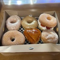 Box of 6 but individually priced (L->R top: glazed, salted caramel, strawberry cream, L->R bottom: sugar, cream brûlée, jam filled)  at Donut Bar - W. A St in San Diego