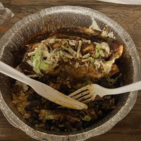 Vegan Enchilada with Vegan Chorizo, Mole, Black Beans and Mexican Rice.  at Serrano Salsa in New York City