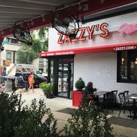 Side of pizza parlor: the sign says "vegan deli"--but the sign is 2 years old; they no longer have a vegan deli here at Zazzy's Pizza - Upper East Side in New York City