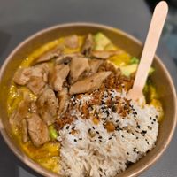Yellow curry with avocado and Planted chicken at Dean & David - Mercedes Platz in Berlin