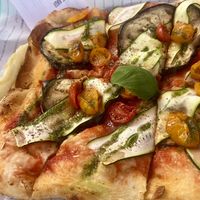 Vegan pizza, with vegetables and basil oil  at Copelia in Padenghe Sul Garda