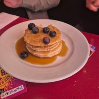 Vegan 5 stack pancakes with maple flavoured syrup and blueberries at The City Cafe in Edinburgh