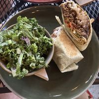 Beef burrito with kale salad  at Vegan Street in Calgary