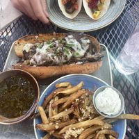 Mushroom taco & no-fish taco on top; beaf dip with garlic fries on bottom. All delicious! at Vegan Street in Calgary