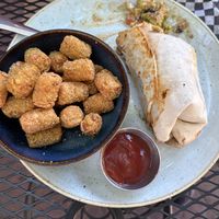 Breakfast Burrito and Parmesan Tater Tots  at Vegan Street in Calgary