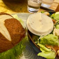 Nashville, hot chicken burger with vegan Caesar salad  at Vegan Street in Calgary