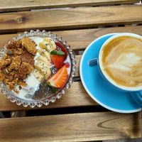 Vegan yogurt bowl and oat milk cappucino at MOYA brunch in Sevilla