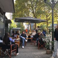 Pleasant seating in court outside venue at The Sweet Vegan in Nuremberg