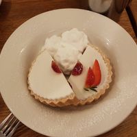 Iced cherry bakewell with whipped vegan cream at The Bakewell Tart Shop in Bakewell