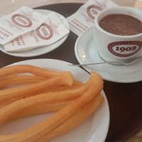 One serving of churros (4) and vegan chocolate. at Chocolateria 1902 in Madrid