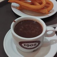 Vegan hot chocolate and churros at Chocolateria 1902 in Madrid