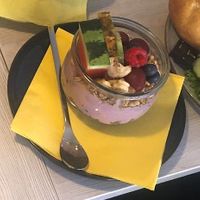 A big glass with berries soy yogurt and fresh fruits  at Le Garcon in Hildesheim