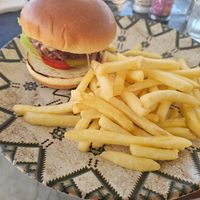 Vegan beyond burger, menu says that all burgers come with fries and onion rings but im guessing the onion rings weren't suitable at Surfside in Sliema
