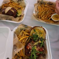 Impossible burger with jalepeno mayo and pretzel bun and seasoned fries, all vegan at HopCat in Indianapolis