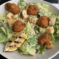 Caesar salad with chicken popcorn bites  at Veggie Grill by Next Level in Santa Monica