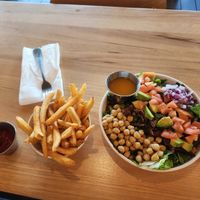 Fries yummy and crispy. This is the bacon salad, so much included 😋 at Veggie Grill by Next Level in Santa Monica