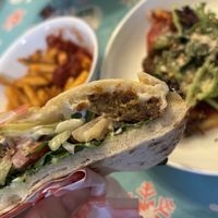Digging in to the Falafel.  I added lettuce, Vegan Parm and hot pepper flakes to the pizza cus I had them.  The pizza is delicious ‘as is” but since I was home...  at Fresca on Addison in Richmond