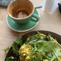 Close up tofu scramble and coconut flat white   at Bonobo Cafe in Christchurch